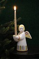 K&Co. presents: 
Aluminia 
Christmas angel 
in faience that 
holds a small 
Christmas 
candle...