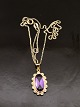 14 carat gold 
pendant with 
amethyst