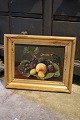 Antique still life oil painting on canvas with fruits framed in an old gold 
frame.