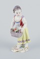 Meissen. Porcelain figurine of girl with basket.