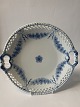 Empire dish with handle with openwork edge.