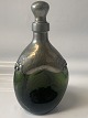 Green carafe with tin mounting and stopper, art deco, 1920s. Denmark.