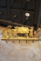 K&Co. presents: 
Antique 
19th century 
coat rack in 
solid bronze 
with 5 hooks 
with a motif of 
a procession of 
animals