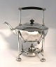 Mappin & Webb. 
Silver-plated 
swing teapot. 
Height 29 cm.