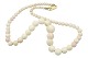 White coral necklace with 14 carat gold lock