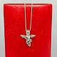 Antik 
Damgaard-
Lauritsen 
presents: 

A necklace 
in 14k white 
gold set with a 
diamond angel