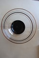 A beautiful bowl made of glass
With gold stripsr, and black and white strips and 
a black bottom
From the 1950-Years
Diam: 17,5cm
H: 8cm
In a good condition