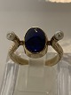 Antik Huset 
presents: 
14 karat 
gold, Women's 
ring Blue stone 
& Pearls.
Ring size 52.