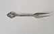 Serving fork in 
silver and 
steel decorated 
with bunch of 
...