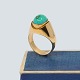 Ring of 14k 
gold, set with 
a turquoise