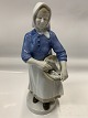 Figure of 
Fisherwoman 
with fish in 
basket
Height 24 cm.