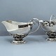 Georg Jensen; A 
set with sugar 
bowl and 
creamer of ...
