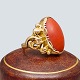 Ring in 14k 
gold, set with 
a coral