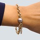 Ole Lynggaard; Bracelet of 14k gold, with clasp in 18k white gold, set with 
diamonds