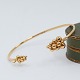 Antik 
Damgaard-
Lauritsen 
presents: 
Georg 
Jensen; A 
Moonlight 
Grapes bangle 
in 18k gold, 
set with 
diamonds