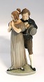 Royal Copenhagen. Porcelain figurine. Man & Woman. Model # 1680. Height 26 cm. 
(1 quality)