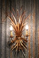 K&Co. presents: 
Large 
gilded Hans 
Kögl metal wall 
lamp
in Hollywood 
Regency style 
from the 60s...