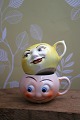 Old children's cups in faience with funny faces. 1 ...