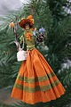 K&Co. presents: 
Old 
Christmas tree 
ornament, nice 
lady made of 
colored crepe 
paper with 
flower bouquet 
and ...