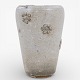 Roxy Klassik presents: Arne Bang.Stoneware vase decorated with white glaze and floral motif. Signed.1 pc. ...