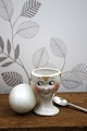 K&Co. presents: Old egg cup from the 1930s in porcelain with a painted funny face.