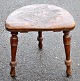 Pegasus – Kunst - Antik - Design presents: Three-legged wooden stool with leather seat, 19th century.