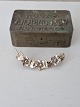 Karstens Antik presents: Vintage silver brooch shaped like a vine with flowers and leaves