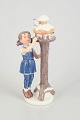 L'Art presents: Royal Copenhagen figurine, girl by birdhouse.