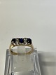 Antik Huset presents: 14 carat Gold Ladies Ring with blue sapphire and clear stone.Size 57.