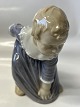 Antik Huset presents: Bing & Grondahl figurine, girl bending down.Decoration No. 1995.