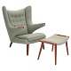 Aabenraa Antikvitetshandel presents: Hans J. Wegner “Papa Bear”. Wingback teak easy chair with matching stool. ...