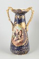 L'Art presents: Faience vase with romantic scene.