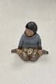 Danam Antik presents: Royal Copenhagen Overglaze Figurine - Boy with Flowers from Greenland No. 12419