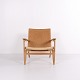 Osted Antik & Design presents: CH25 Lounge Chair in Patinated Solid Oak and Woven Paper Cord by Hans J. Wegner