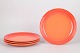 Le Creuset, set of four dinner plates.