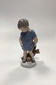 Royal Copenhagen Figurine of Boy with Teddy Bear No. 3468