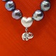 Antik Damgaard-Lauritsen presents: Ole Lynggaard; Heart clasp in 14k white gold with elephant key pendant