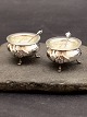 A pair of silver salt cellers with glass insert