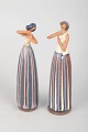 Two figures by Cay Cedergren.