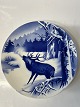 Red deer among trees in winter.Ø 20.5 cm