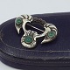 Antik Damgaard-Lauritsen presents: Mogens Ballin; Art Nouveau brooch in silver set with garnets and chrysoprase