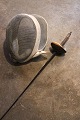 Decorative, old French fencing mask with sword...