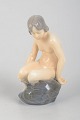 Adda Bonfils for Royal Copenhagen, girl on rock.