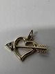 14 k. Heart with arrow inlaid with a zircon.Charms / ...