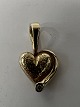 14 carat gold. Heart with inlaid diamond.Charms / ...