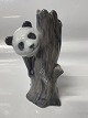 Antik Huset presents: Royal Copenhagen figurine, Panda on a tree stump. Height 13 cm. No. 664.