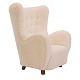 Upholstered high-back lounge chair appears with new ...