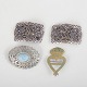 Set of two belt buckles and two brooches.