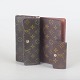 Louis Vuitton, two wallets and key holder.