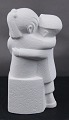 Stone Art white figurine from Marbell, The Netherlands. Couple of siblings on a bench.